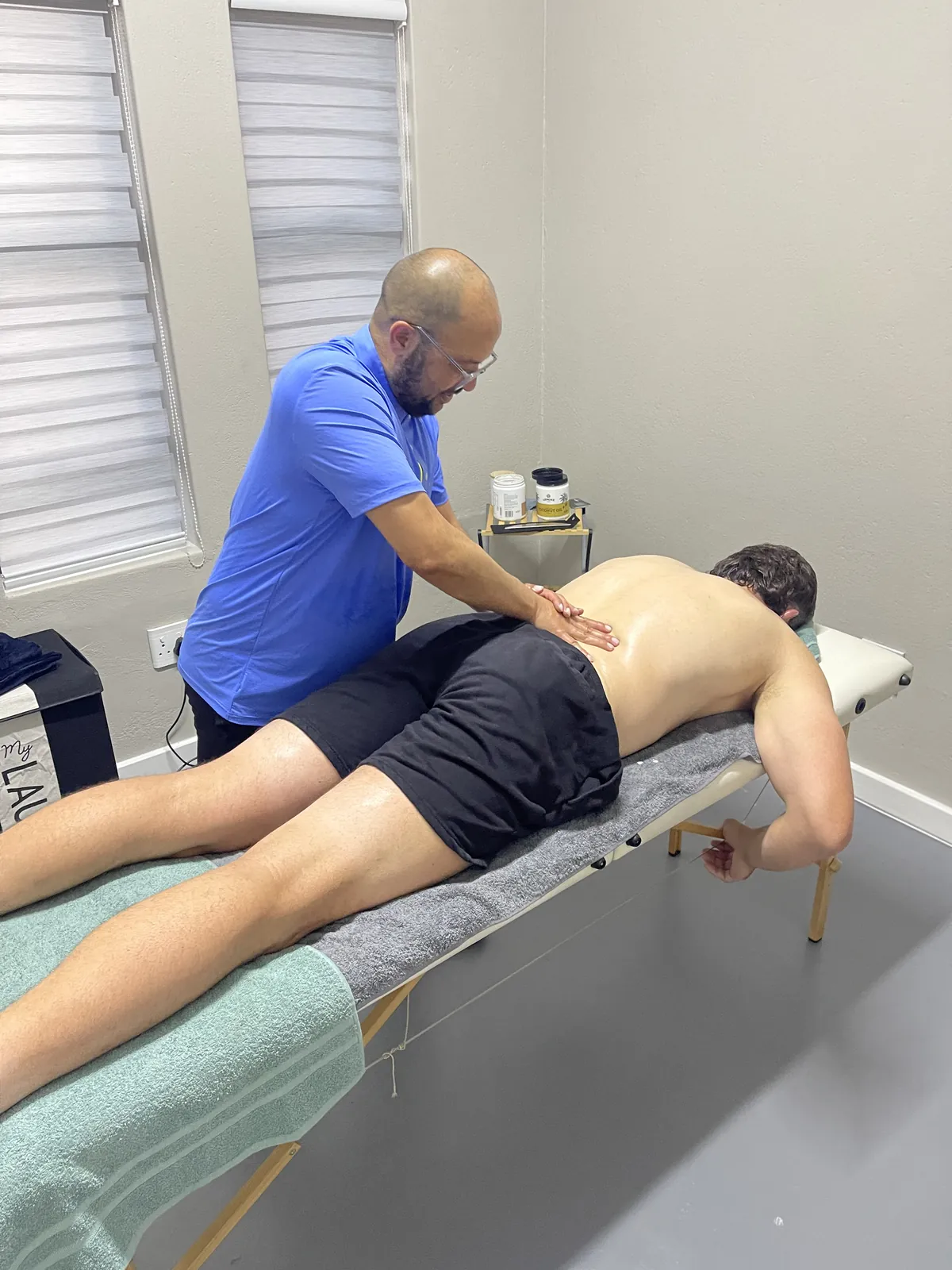 England Rugby player receiving hands-on soft-tissue treatment at the Botthms Wellness Hub, Randburg