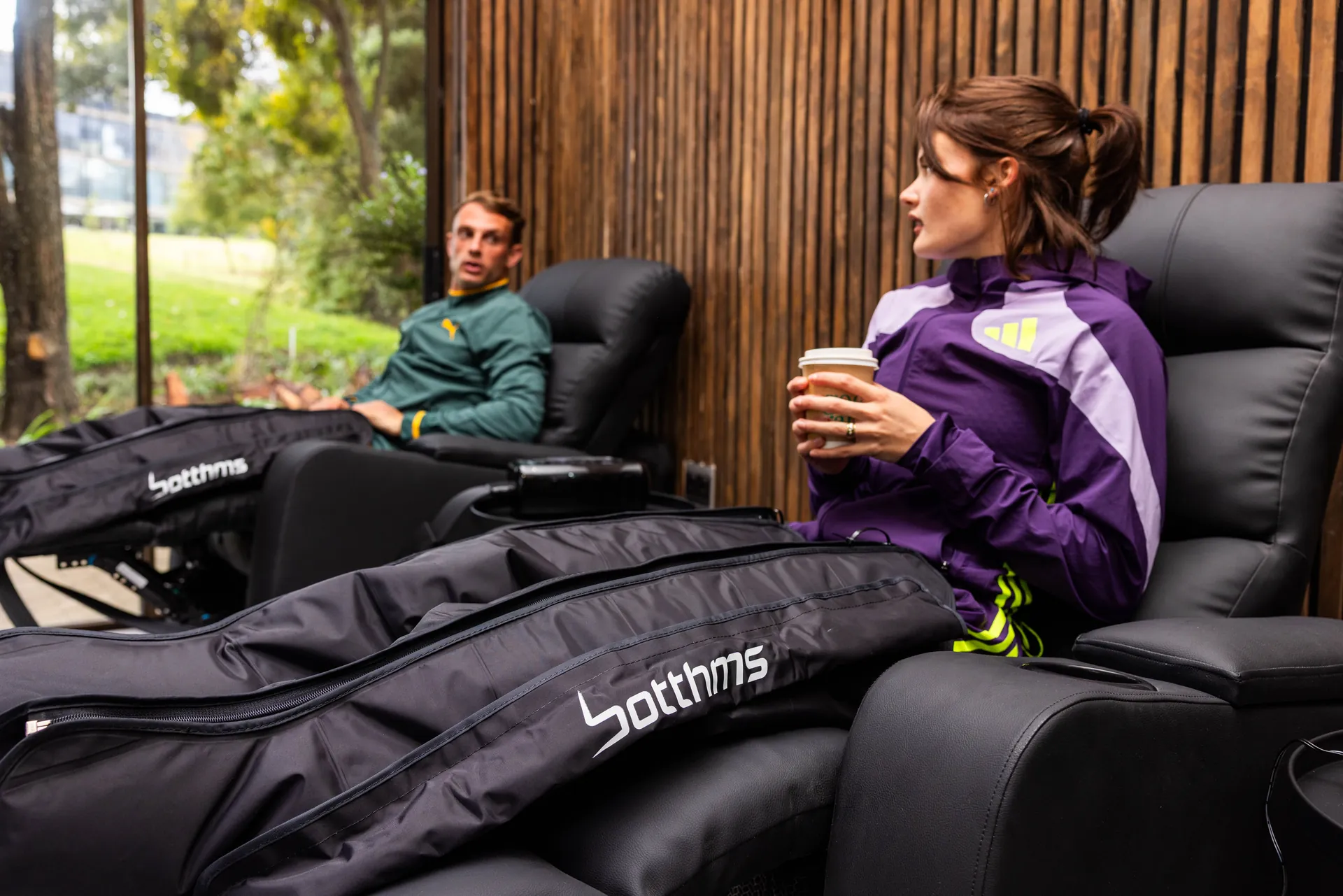 South African athletes Morné van As and Kayla la Grange using botthms compression recovery boots at the Botthms Wellness Hub, Randburg